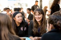 students talking with headmaster